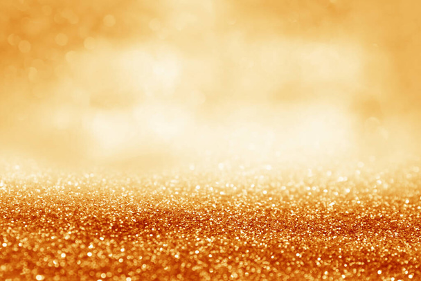 Shiny orange glitter and blurred lights on background. Bokeh effect - Fotografie, Obrázek