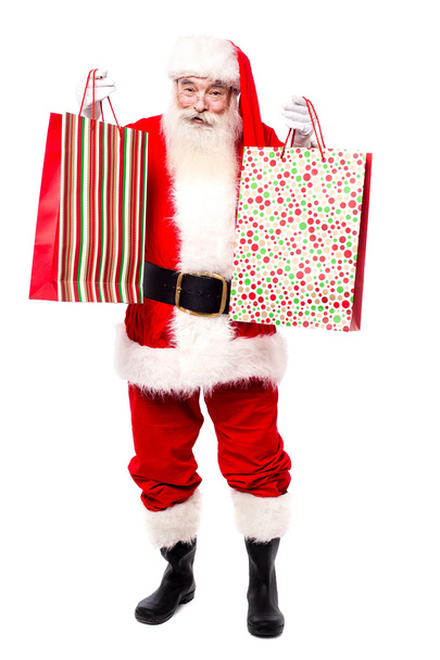 Santa Claus shopping for gifts - Фото, изображение