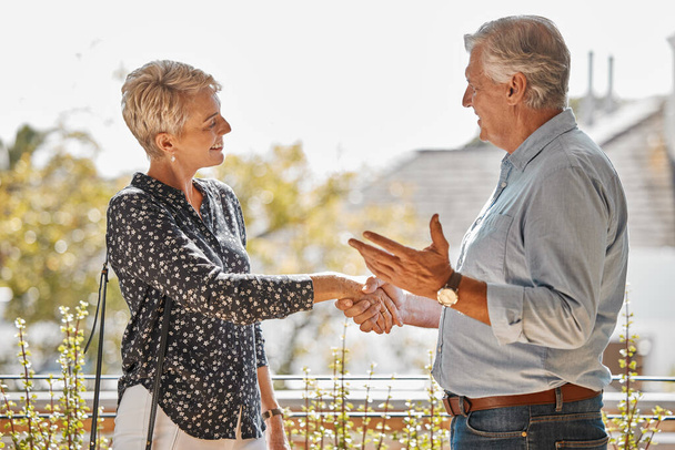 Welcome to your new home. a senior realtor shaking hands with a client - Φωτογραφία, εικόνα