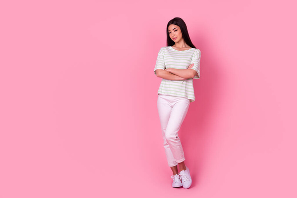 Full size photo of lovely malaysian young lady folded hands empty space isolated on pink color background. - Foto, Imagem