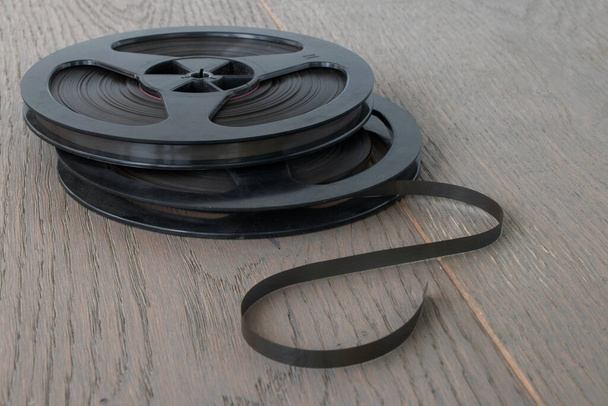 reels of magnetic tape from a vintage audio tape recorder, close-up - 写真・画像