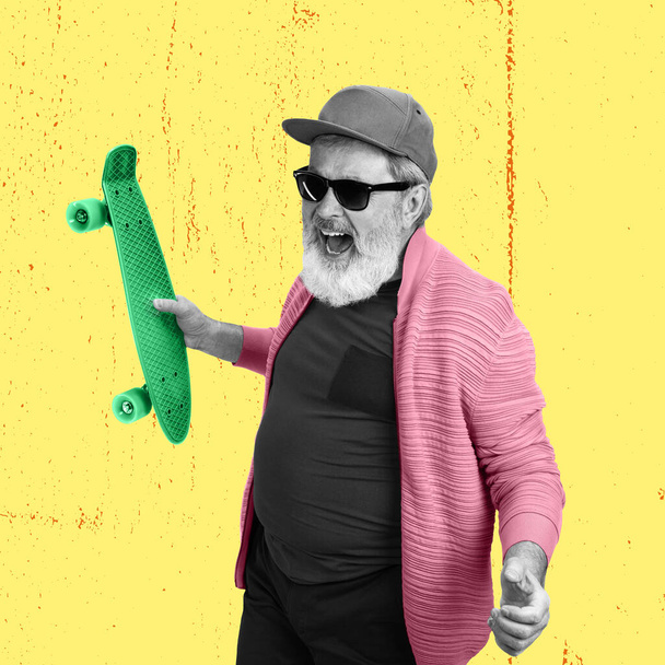 Hobbies. Stylish emotional senior man over yellow background. Collage in magazine style. Surrealism, art, creativity, fashion and retro style concept. Old men like young people in modern life - Photo, image