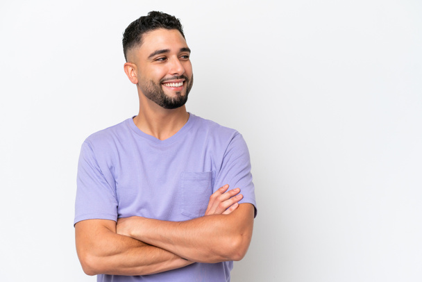 Young Arab handsome man isolated on white background with arms crossed and happy - Fotoğraf, Görsel