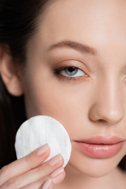 close up view of cropped young woman removing makeup with cotton pad - Photo, Image