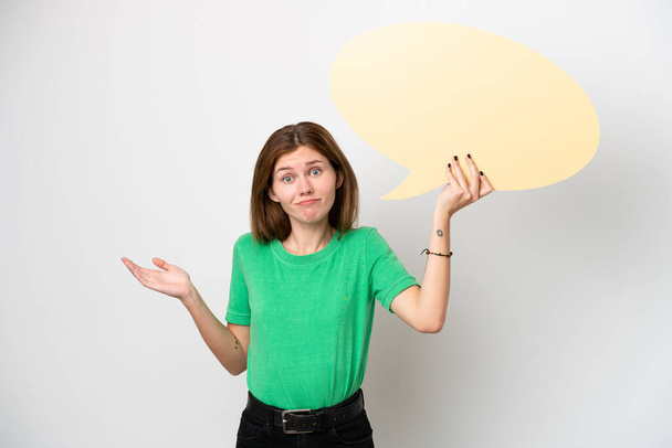 Young English woman isolated on white background holding an empty speech bubble and having doubts - Photo, Image