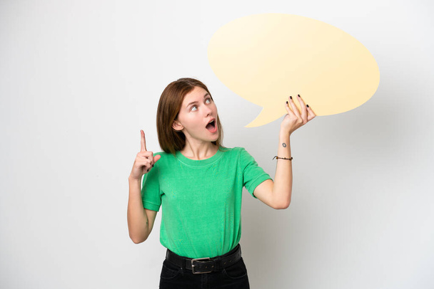 Young English woman isolated on white background holding an empty speech bubble and thinking - Фото, зображення