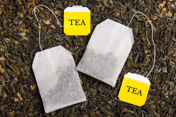 close up of background with dried tea and two tea bags - Photo, Image
