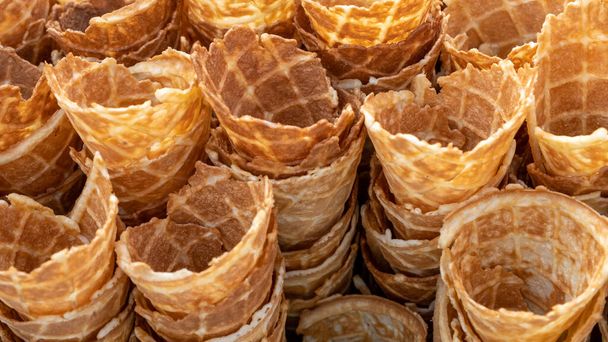 Ice cream waffle cones are prepared for ice cream filling. Rural market. - Φωτογραφία, εικόνα