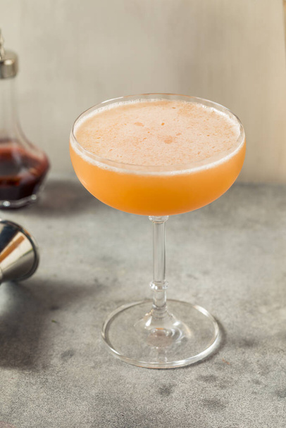 Boozy Refreshing Allspice Bourbon Lions Tail Cocktail in a Coupe - Φωτογραφία, εικόνα