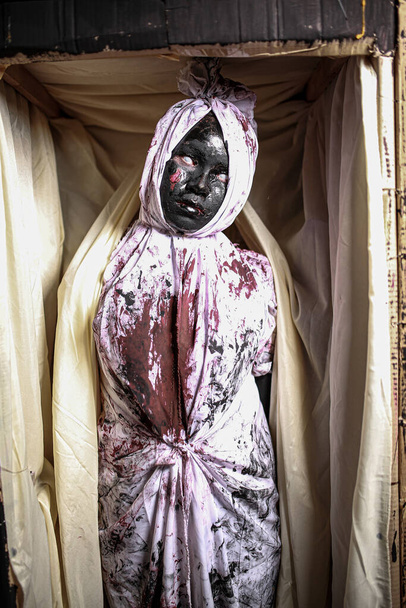 Nakhon Ratchasima, Thailand - 31 October 2019 : Organizing a fashion contest in ghost costumes on halloween night portrait of make up Thai ghost face with blood, wearing typical Thai dress.  - Fotó, kép