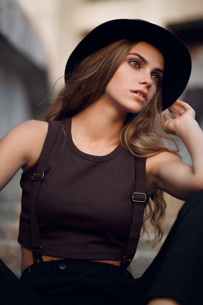 Closeup fashion woman portrait of young pretty trendy girl posing in city - Photo, Image
