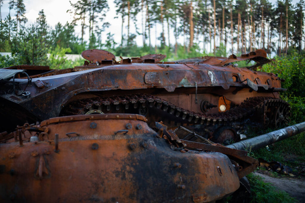The destroyed and burned modern tank of the russian army in Ukraine in the war in 2022 - Photo, image