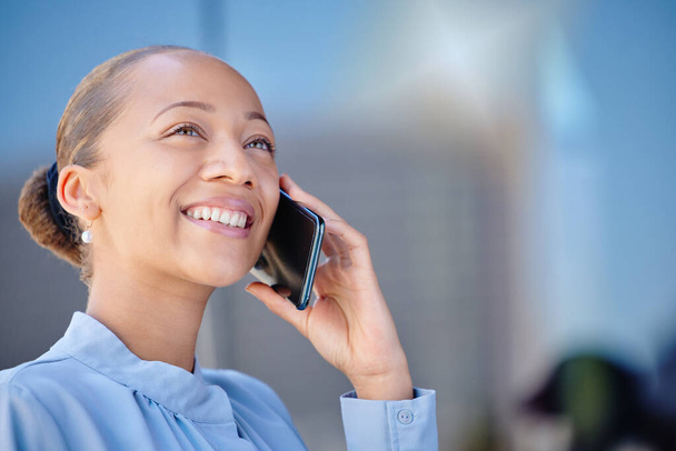 Closeup of a happy and beautiful smiling businesswoman while on the phone. Female adult manager making answering call in mobile roaming, lady having pleasant phone conversation with client. - Foto, Imagem