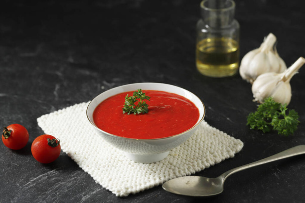 A Bowl of Homemade Tomato Creamy Soup with Parsley on Top - Фото, изображение
