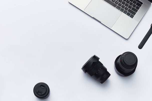 The three camera lenses with a laptop on a white background - Photo, image
