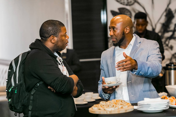 A Johannesburg, South Africa - June 27, 2018: Delegates networking at retail industry conference - 写真・画像
