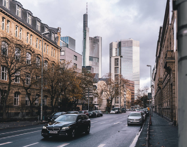 A modern car along the street with Commerzbank Tower background in Frankfurt, Germany - Foto, imagen