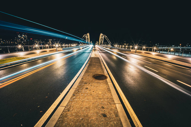An illuminated bridge at night - Foto, Imagem