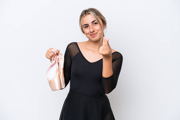 Young caucasian woman practicing ballet isolated on white background making money gesture - Φωτογραφία, εικόνα