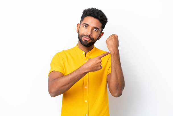 Young Brazilian man isolated on white background making the gesture of being late - Φωτογραφία, εικόνα