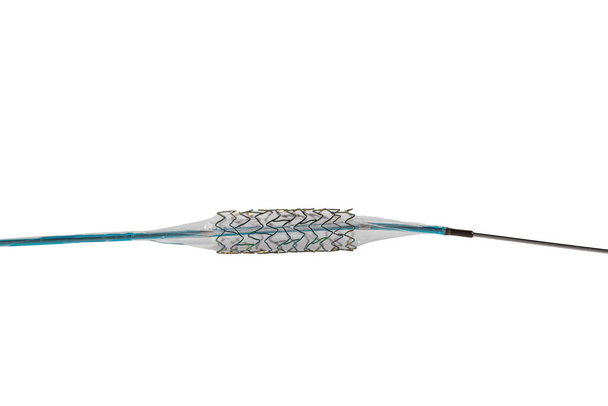 Heart Stent angioplasty. Stent and catheter for implantation into blood vessels with an empty and filled balloon. High resolution photo isolated on a white background. - Foto, afbeelding