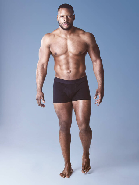 Keep moving forward no matter what. Full length shot of a handsome young man posing shirtless in the studio - Photo, Image