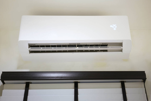 wall installed air conditioner make room cool low angle view - Foto, immagini
