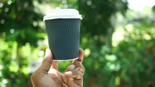 men holding a take away paper coffee cup outdoor , pov  - Footage, Video