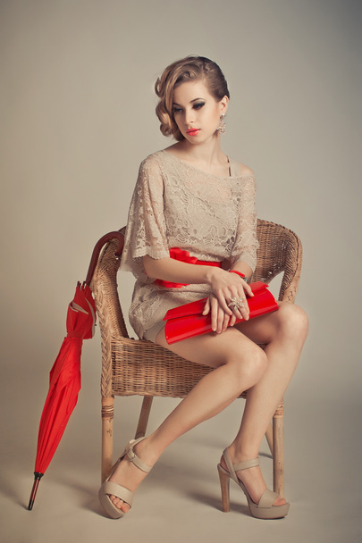 The girl in a grey dress with red accessories 1232. - Fotoğraf, Görsel