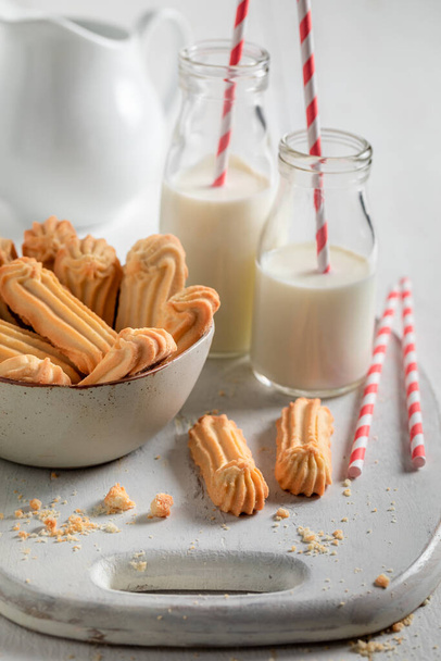 Homemade and tasty shortbread cookies served with milk in bottle. Shortbread cookies best taste with milk. - Photo, Image