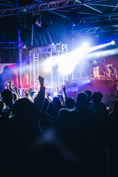 A music event with dancing crowd and disco lights - 写真・画像