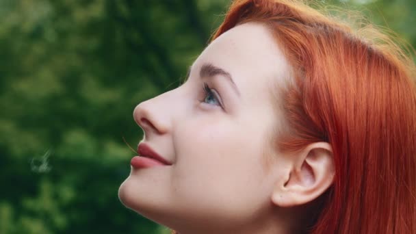 Close up profile female face young caucasian pretty beautiful woman girl redhead teenage dreamer posing outside model with perfect clean skin short stylish hairstyle natural day make up beauty concept - Footage, Video