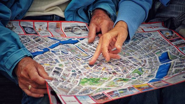 A closeup shot of hands on the map, concept of travelling - Photo, image