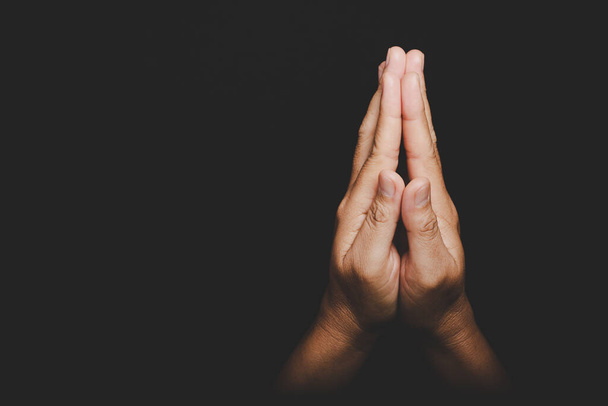 Close up Asian christian woman hands person pray and worship for thank god in church with black background, The concept for faith, spirituality and religion - Fotó, kép