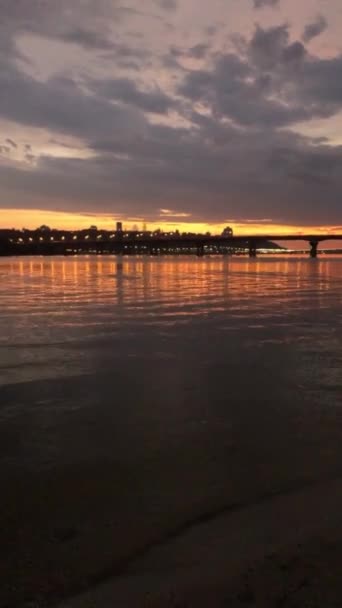 Sunset in the city by the river. Summer in Kyiv. Dnipro river - 映像、動画