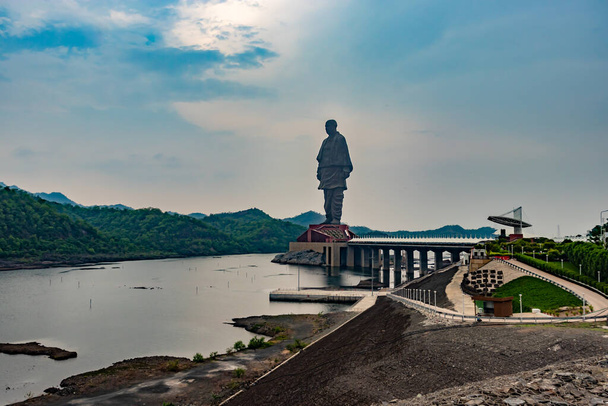 statue of unity the world tallest statue with bright dramatic sky at day from different angle image is taken at vadodra gujrat india on July 10 2022. - Photo, Image