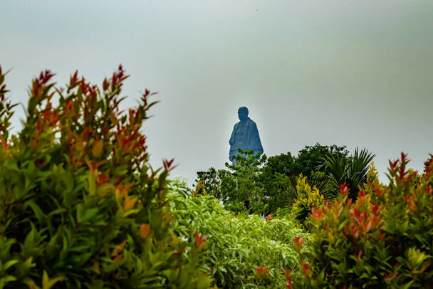 statue of unity the world tallest statue with bright dramatic sky at day from different angle image is taken at vadodra gujrat india on July 10 2022. - Фото, изображение