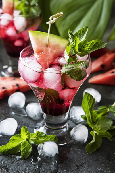 Close-up fresh watermelon drink  in glasses with watermelon pieces on dark  background - Fotó, kép