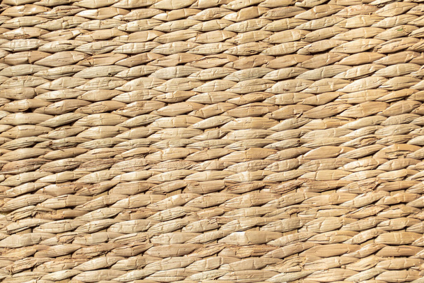 background of light yellow mat woven from reeds. - Fotoğraf, Görsel