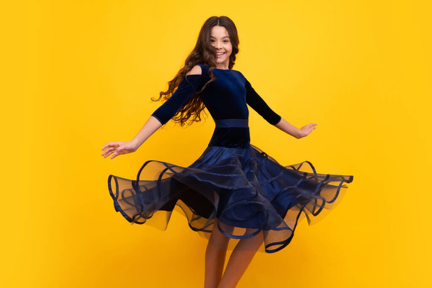 Full length of teenager child girl wearing ball dress. Happy face, positive and smiling emotions of teenager girl. Movement dress of young child teen girl - Fotoğraf, Görsel