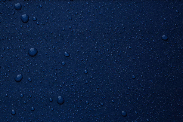 Many water drops on bright blue background - Photo, Image