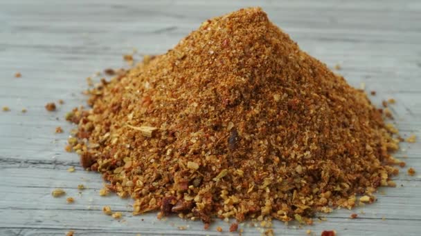 Pile of gyros kebap spices mix isolated. Blended pita kebab red spice powder with seasoned salts, grounded oregano, paprika, cumin, pepper, salt, saffron, coriander and basil - Footage, Video