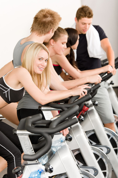 Fitness group of on gym bike - Фото, изображение