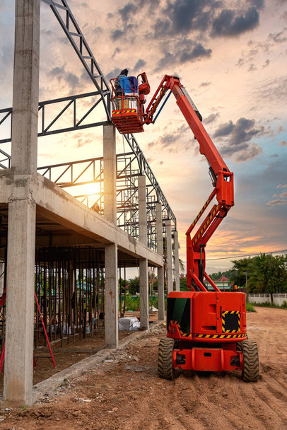 Aerial platform for workers who work at height on buildings. Construction machine.  - Fotó, kép