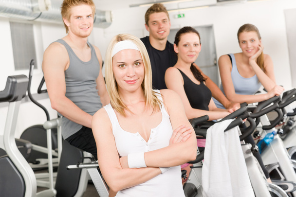 Fitness young group at gym bicycle - Zdjęcie, obraz