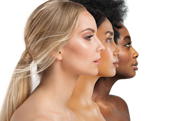 Beauty Diversity Faces. Multi Ethnic Women Caucasian, African and Asian. Three Woman Profile with different Skin Type and Color over White Isolated. Facial Care Cosmetics and Make up - 写真・画像