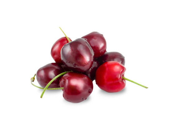 Ripe red cherries isolated on a white background. Fresh fruits. - Foto, Bild