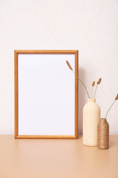 Mock up empty wooden frame mockup, dried grass in vase on white background, interior, home design. Art concept. copy space. - Foto, immagini