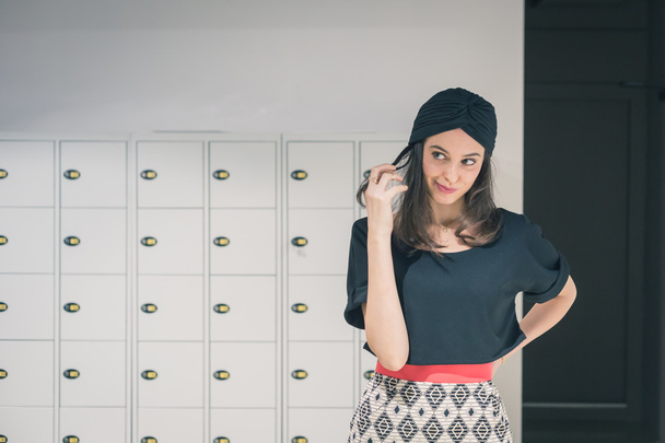Beautiful young brunette posing in an office - Foto, Imagen