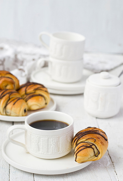 Puff pastry rolls with chocolate and coffee cup - Foto, imagen